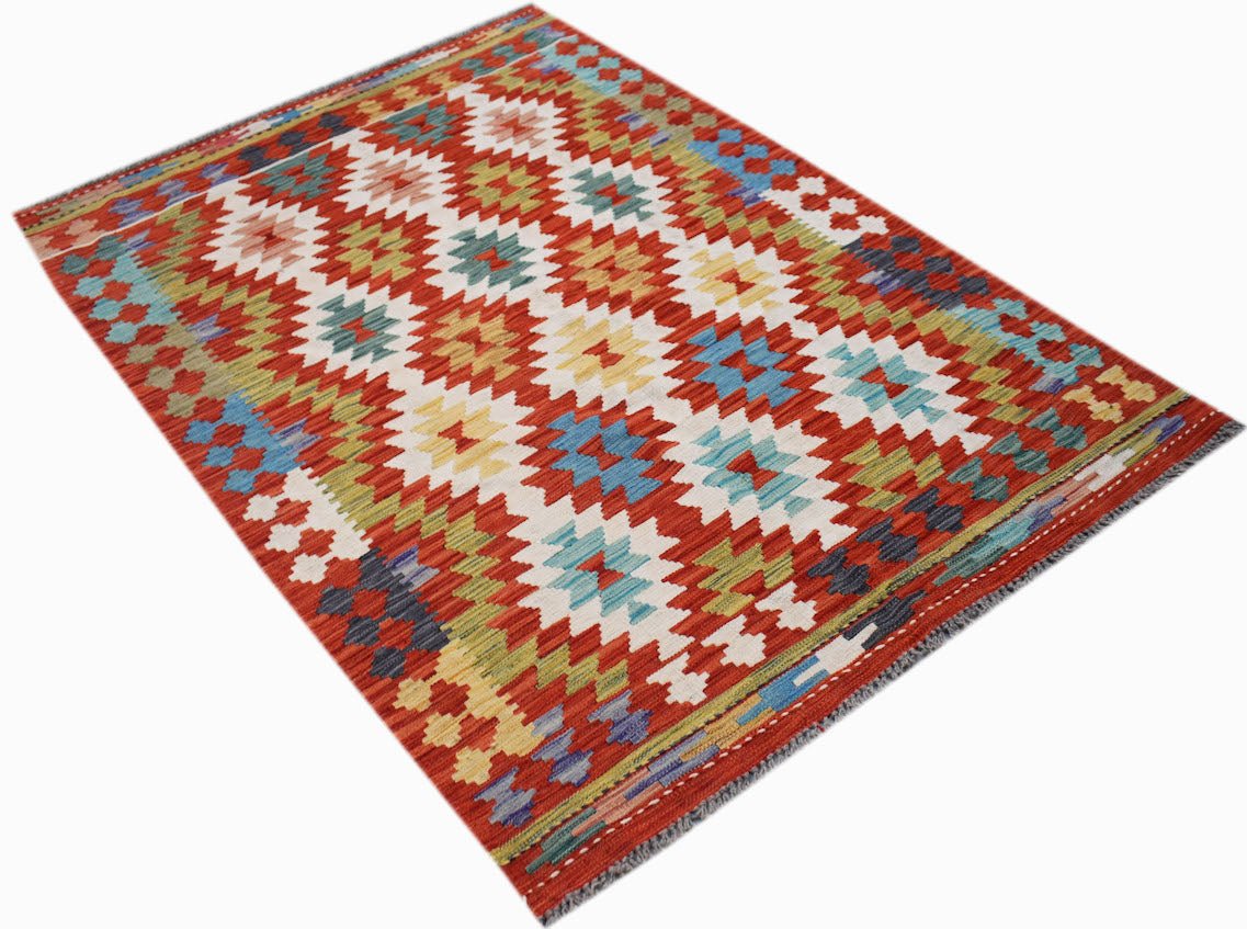 Handwoven Afghan Maimana kilim rug featuring a vibrant geometric pattern in wool.