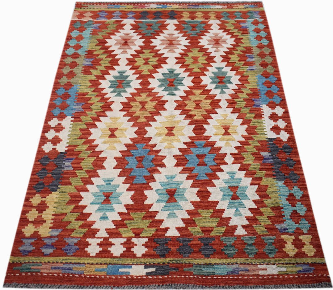 Handwoven Afghan Maimana kilim rug featuring a geometric diamond pattern in vibrant colors.