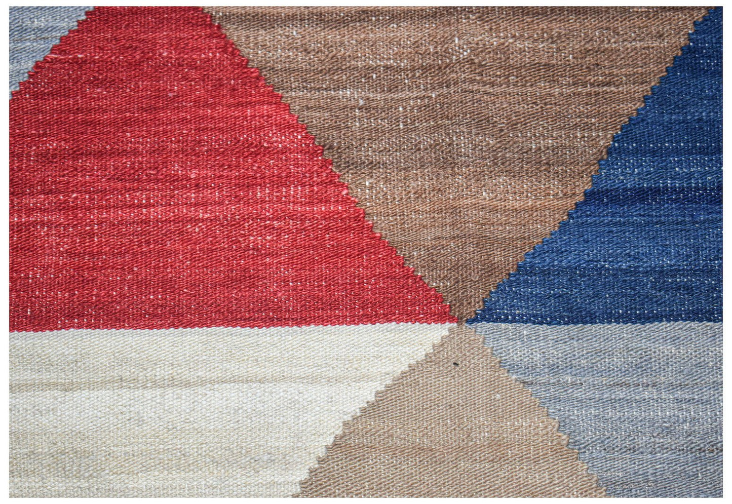 A handmade Afghan Maimana kilim featuring a geometric pattern in red, blue, brown, and cream.