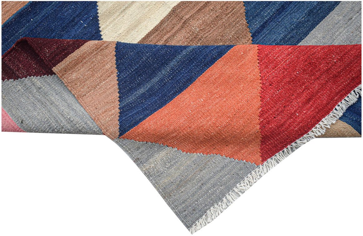 Afghan Maimana Kilim with geometric patterns in red, blue, and earth tones.