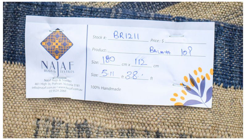 Afghan Maimana Kilim with a tag showing dimensions and stock number.