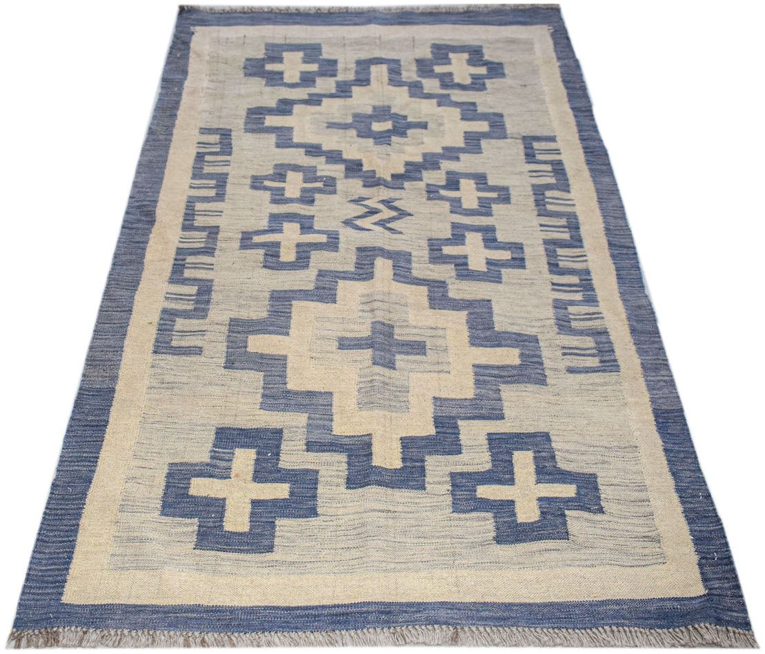 Handwoven Afghan Maimana kilim rug featuring a blue and cream geometric pattern.