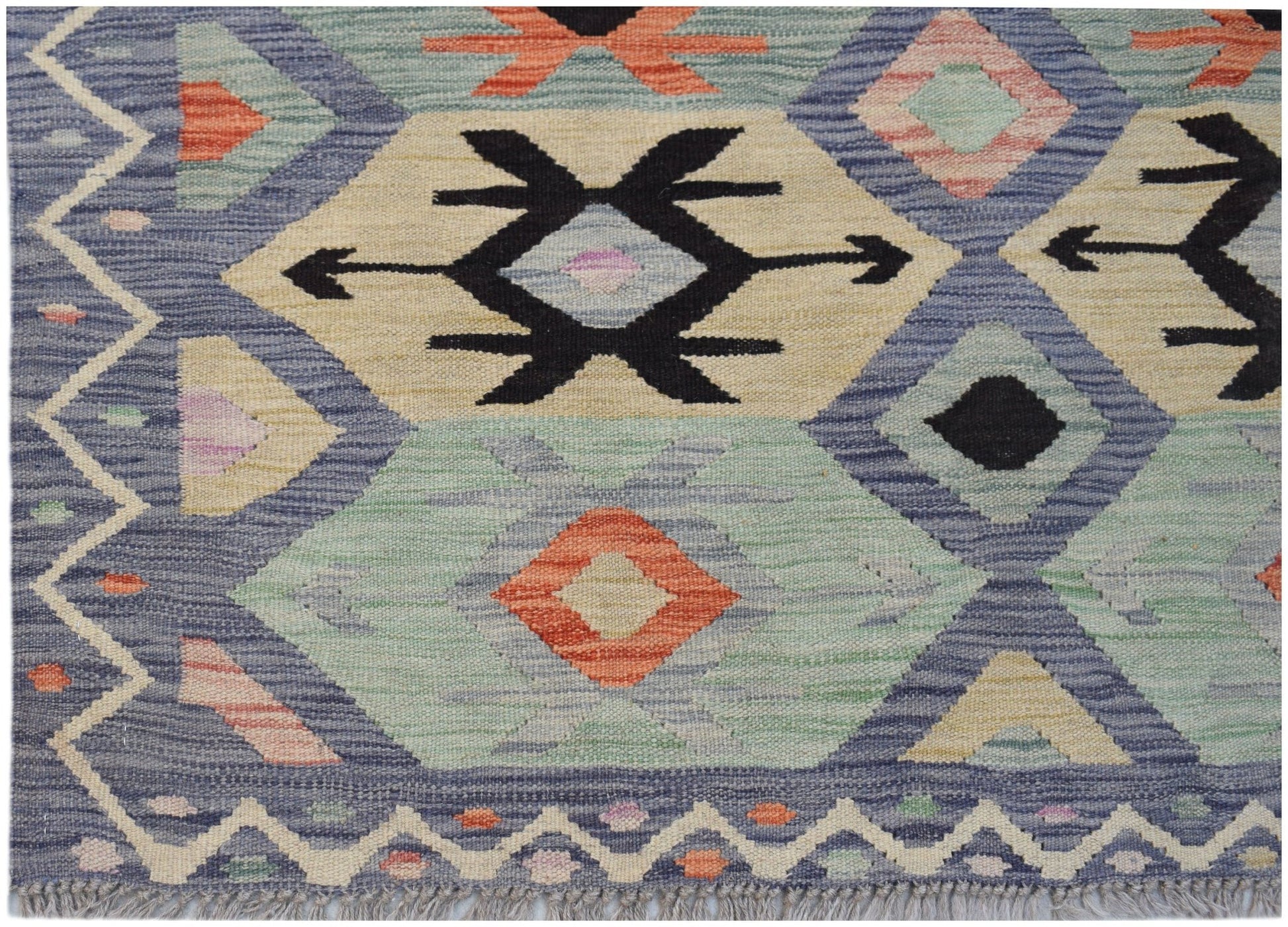 Handwoven Afghan Maimana kilim featuring a geometric pattern in blue, cream, and orange tones.