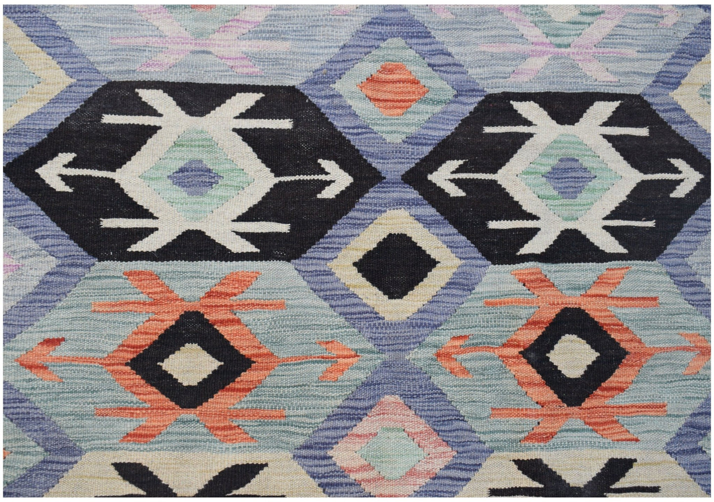 Handwoven Afghan Maimana kilim featuring a geometric pattern in blue, black, and orange wool.