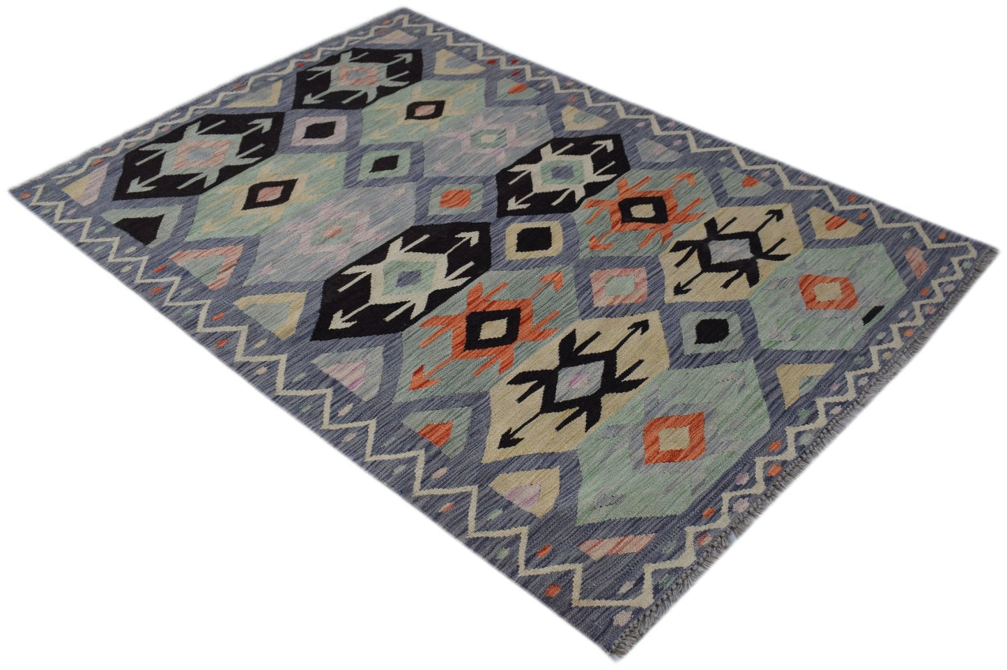 Handwoven Afghan Maimana kilim rug featuring a geometric pattern in blue, orange, and cream tones.