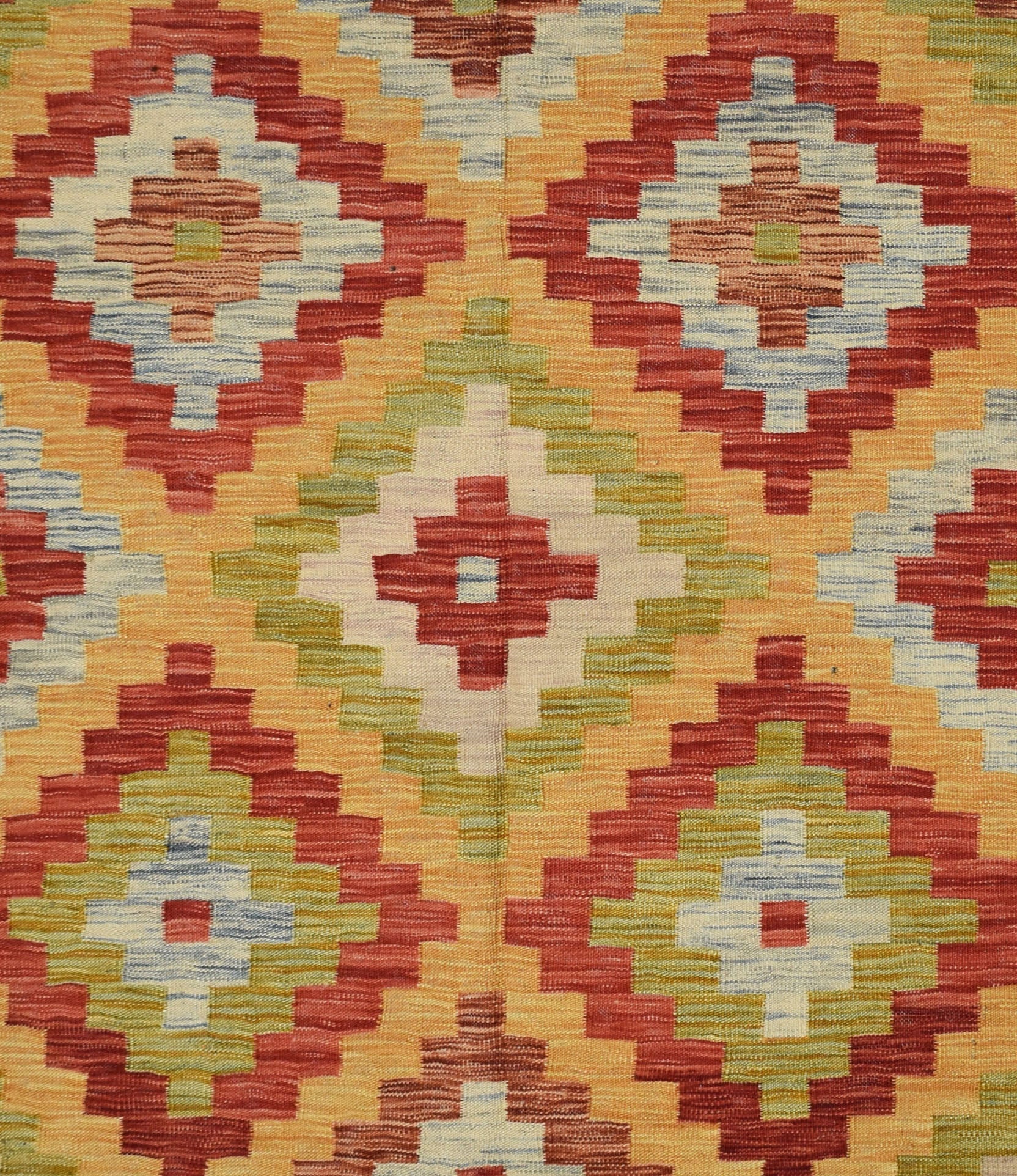 Handmade Afghan Maimana kilim rug featuring a geometric diamond pattern in warm earth tones.