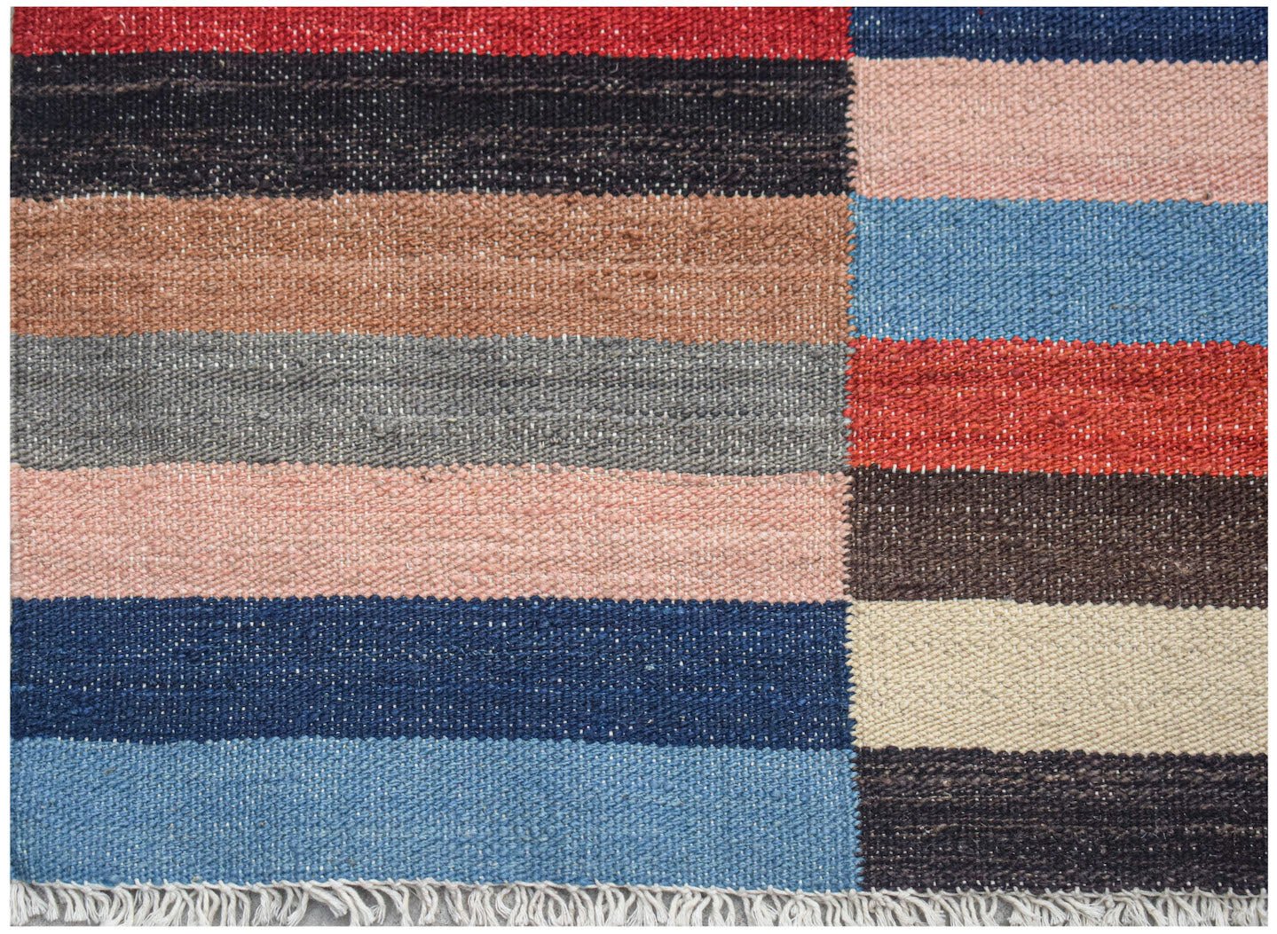 Handwoven Afghan Maimana kilim rug featuring a colorful geometric striped pattern and fringe.