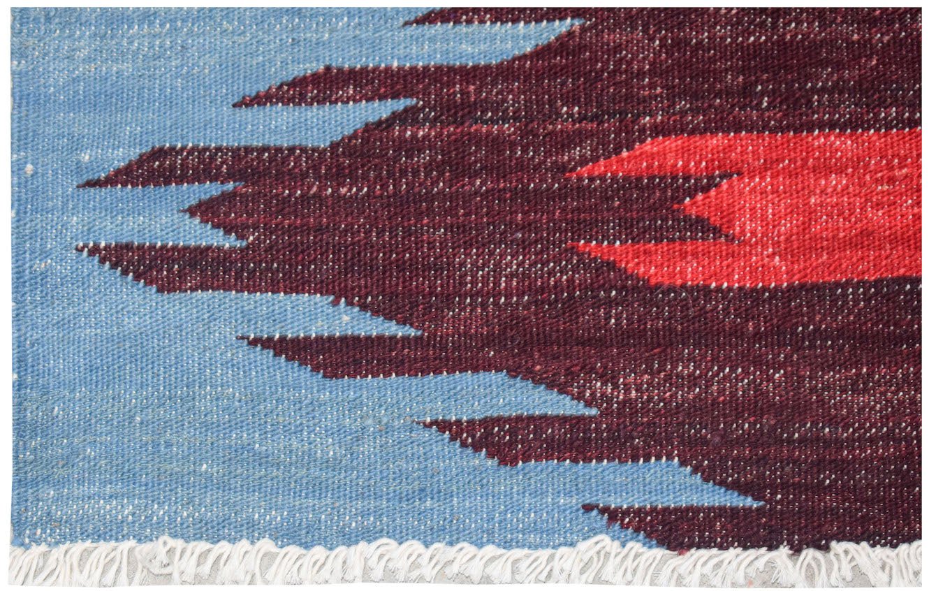 Handwoven Afghan Maimana kilim featuring a geometric pattern in blue, dark red, and bright red.