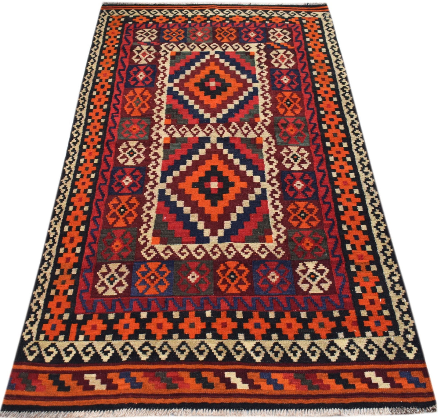 Handwoven Afghan Maimana kilim rug featuring geometric diamond patterns in red, blue, and orange.