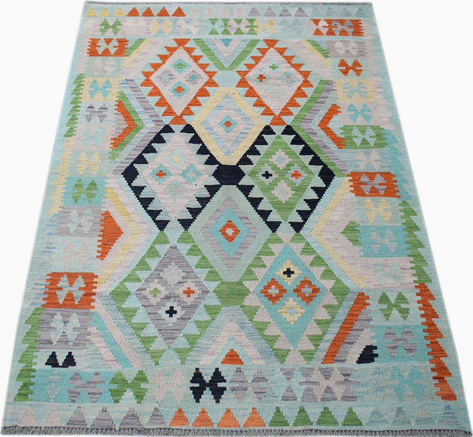 Handwoven Afghan Maimana kilim rug featuring a geometric diamond pattern in vibrant colors.