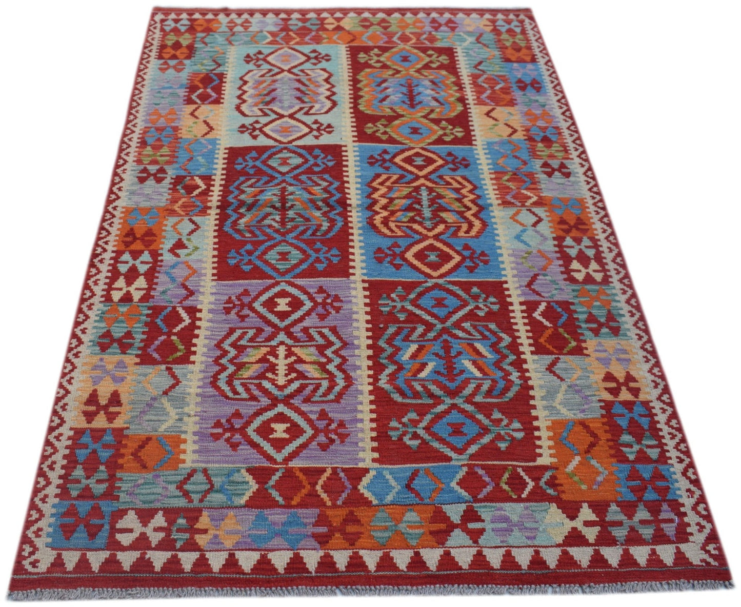 Handwoven Afghan Maimana kilim rug featuring a colorful geometric pattern in wool.