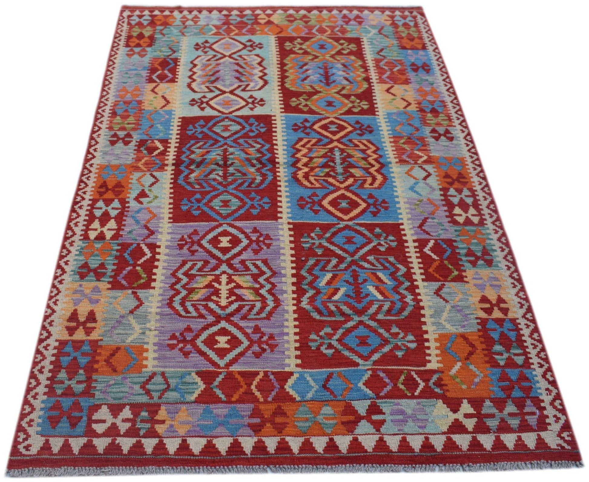 Handwoven Afghan Maimana kilim rug featuring a colorful geometric pattern in wool.