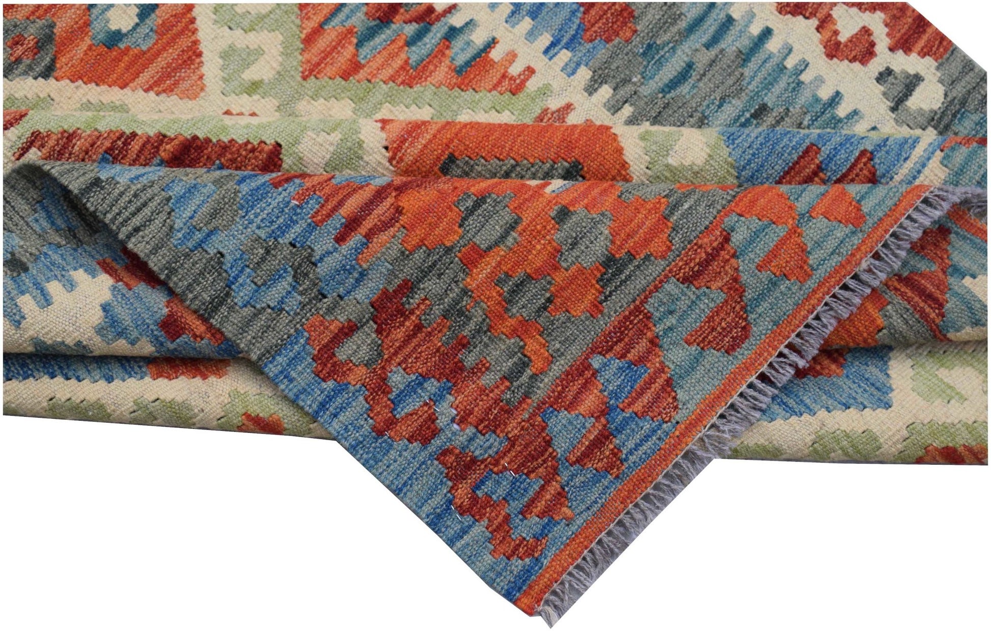 A handwoven Afghan Maimana kilim rug featuring a geometric pattern in red, blue, and green wool.