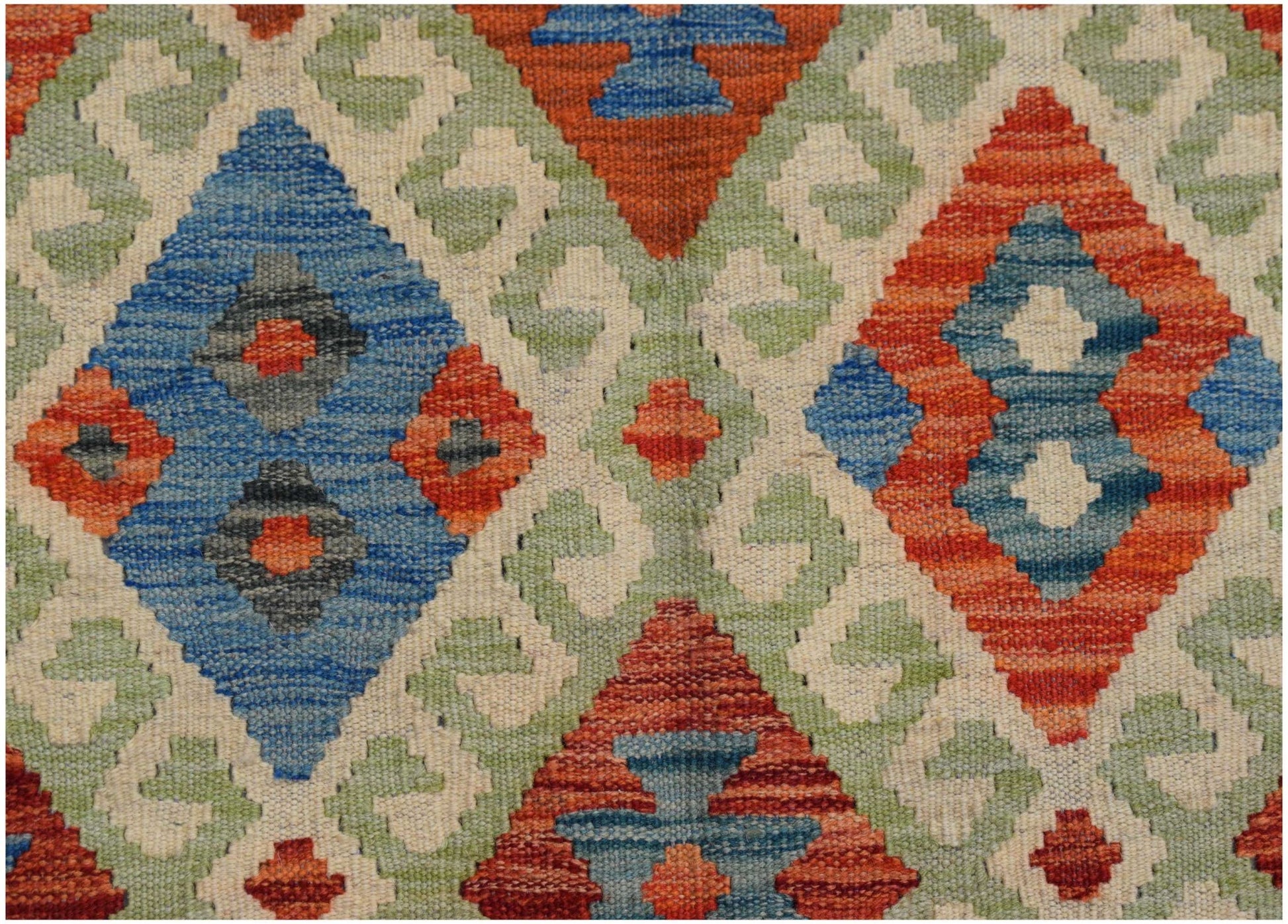 Handwoven Afghan Maimana kilim featuring a geometric diamond pattern in blue, orange, and green.