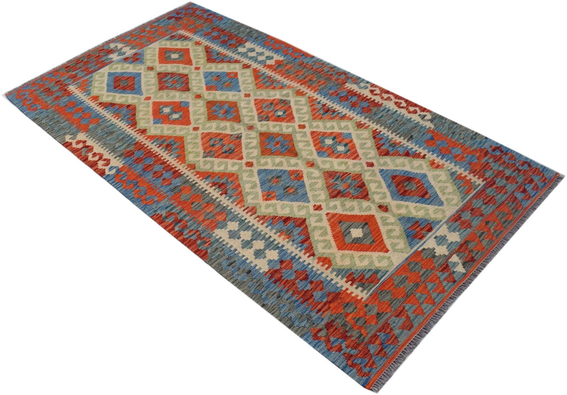 Handwoven Afghan Maimana kilim rug featuring a geometric diamond pattern in red, blue, and green.