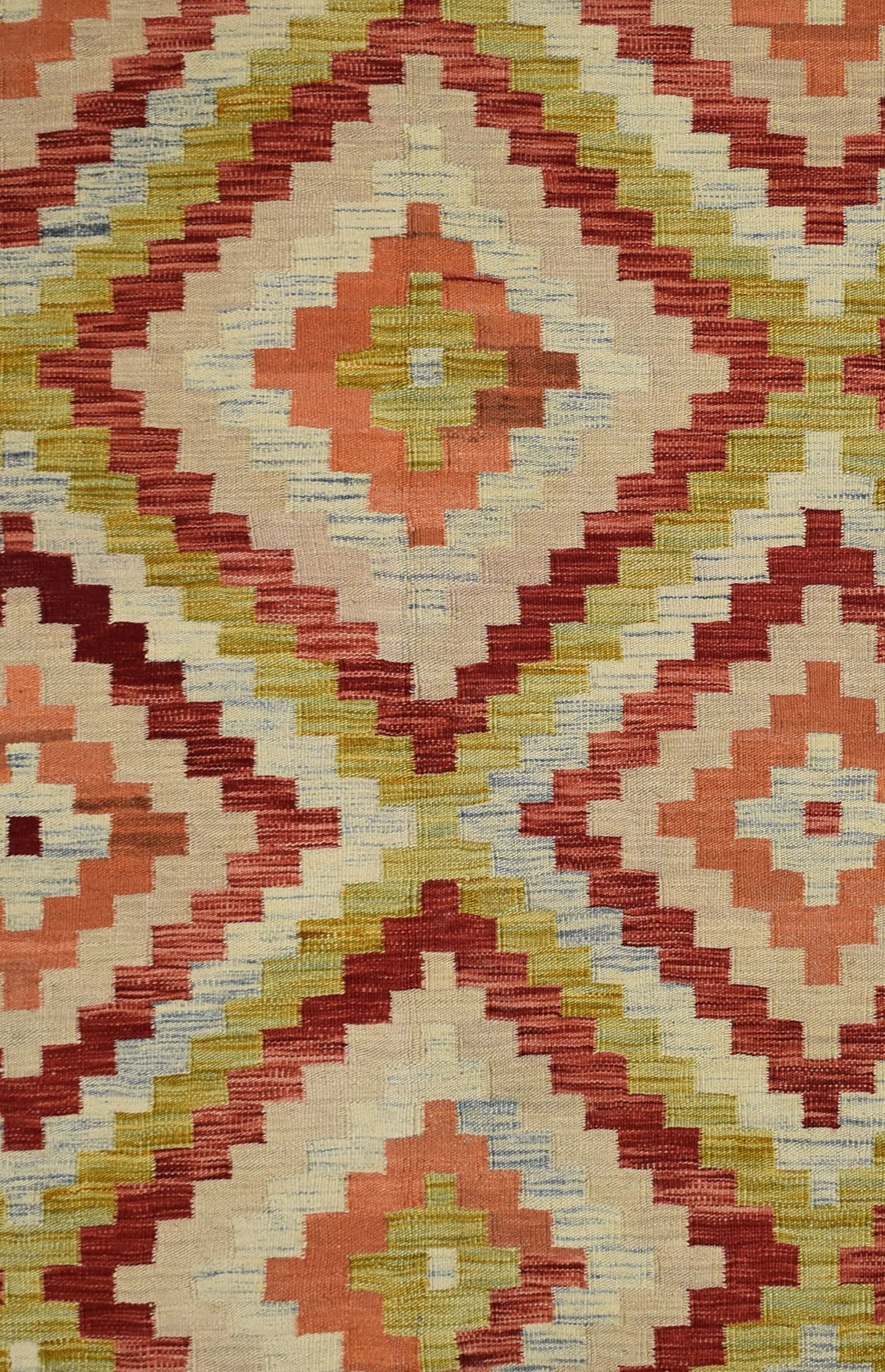 Handmade Afghan Maimana kilim rug featuring a geometric diamond pattern in red, green, and cream.