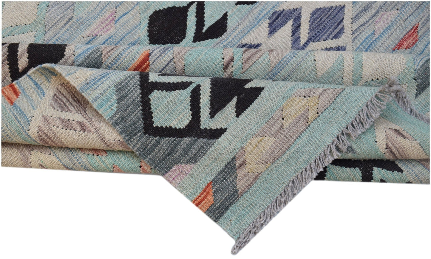 A handwoven Afghan Maimana kilim rug featuring geometric patterns in blue and neutral tones.