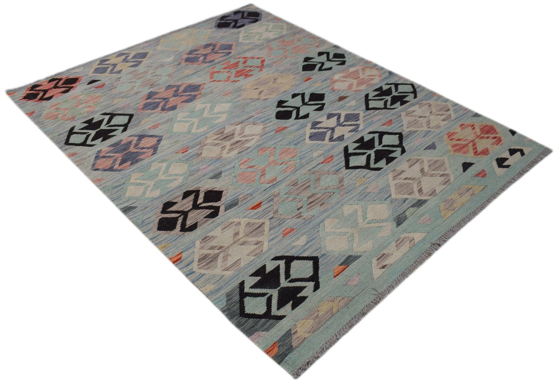 A handmade Afghan Maimana kilim rug featuring a light blue background with geometric patterns.
