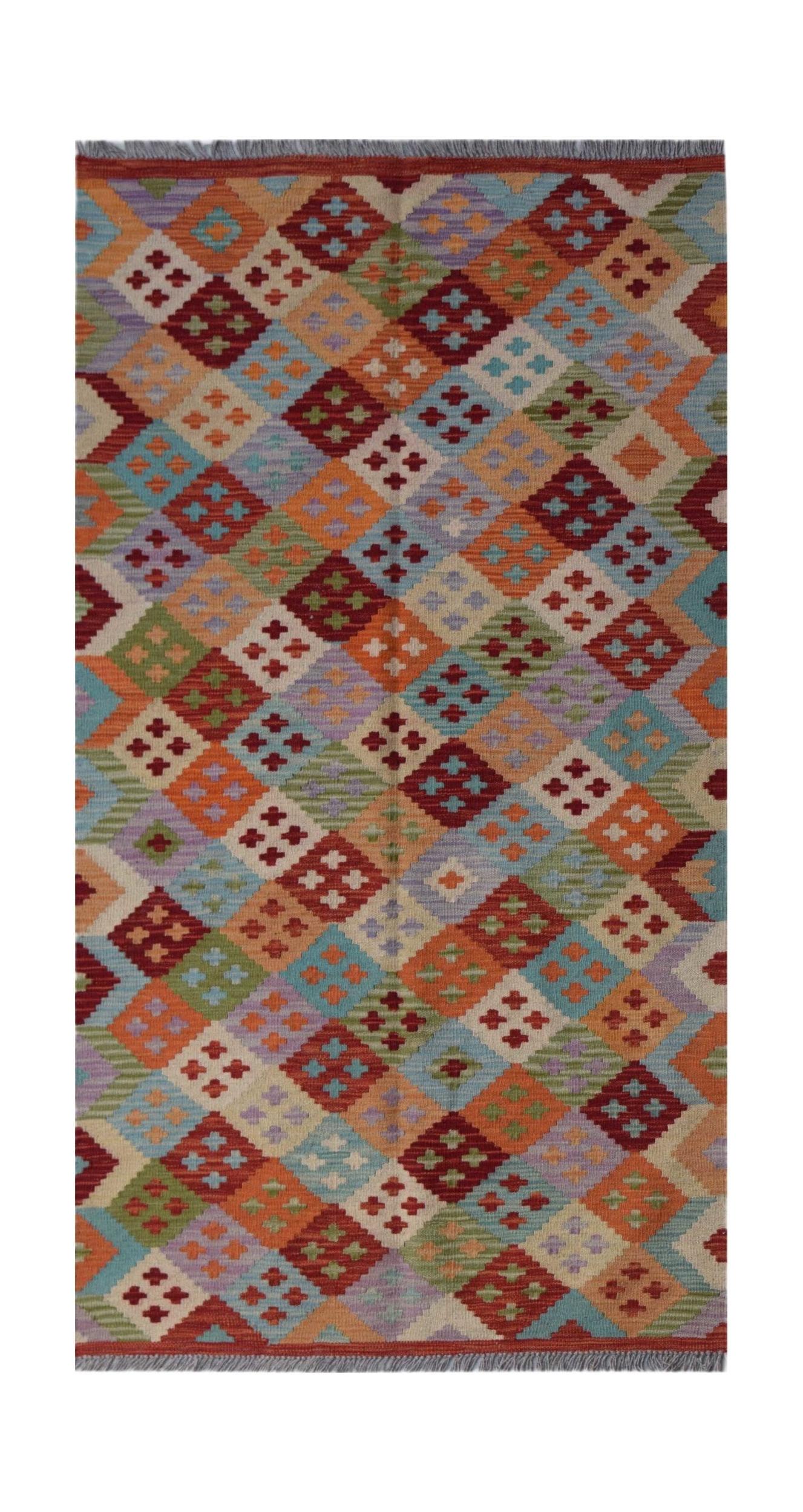 Handwoven Afghan Maimana kilim rug featuring a colorful geometric diamond pattern in wool.