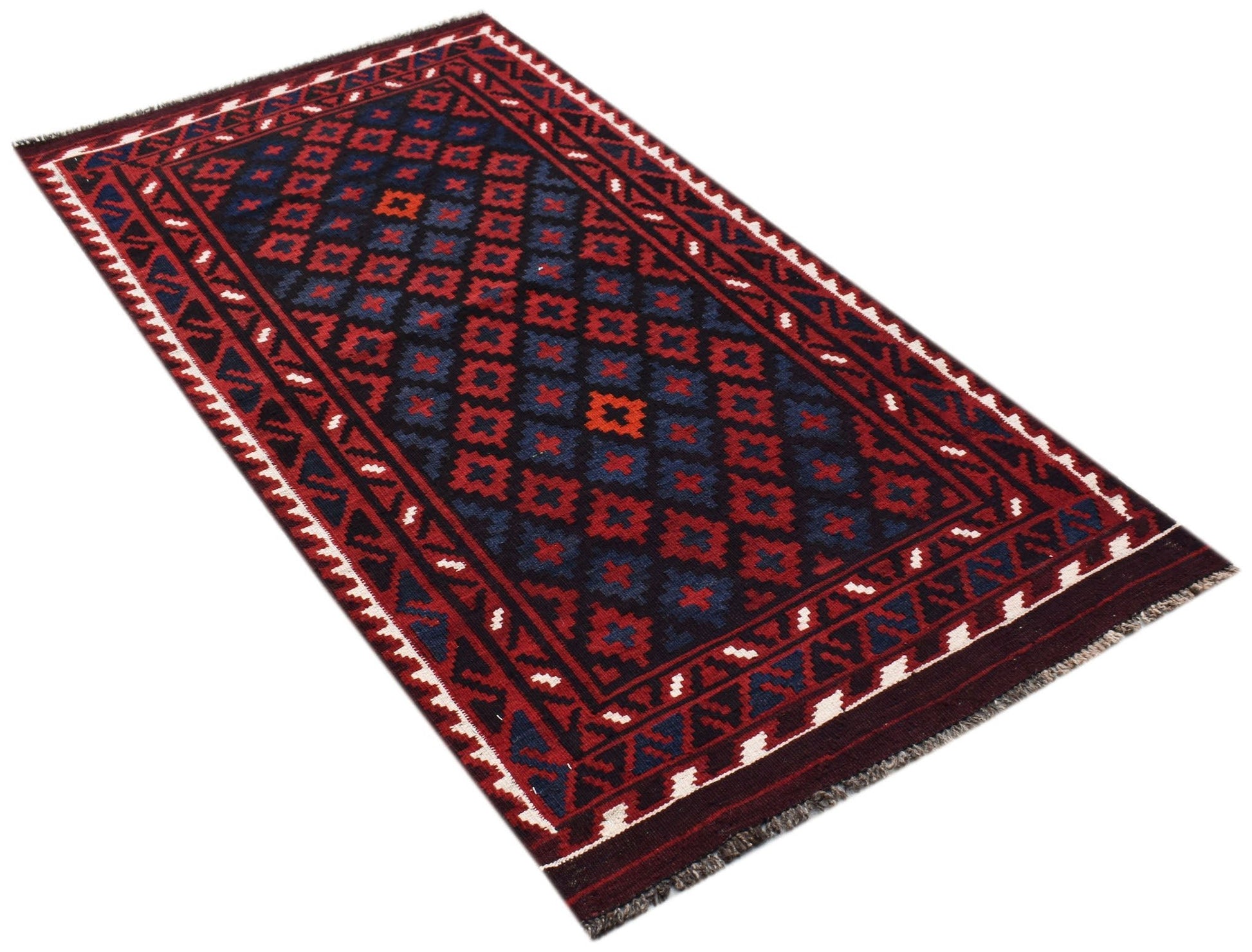 A rectangular Afghan Maimana kilim rug featuring a geometric pattern in red, blue, and dark tones.