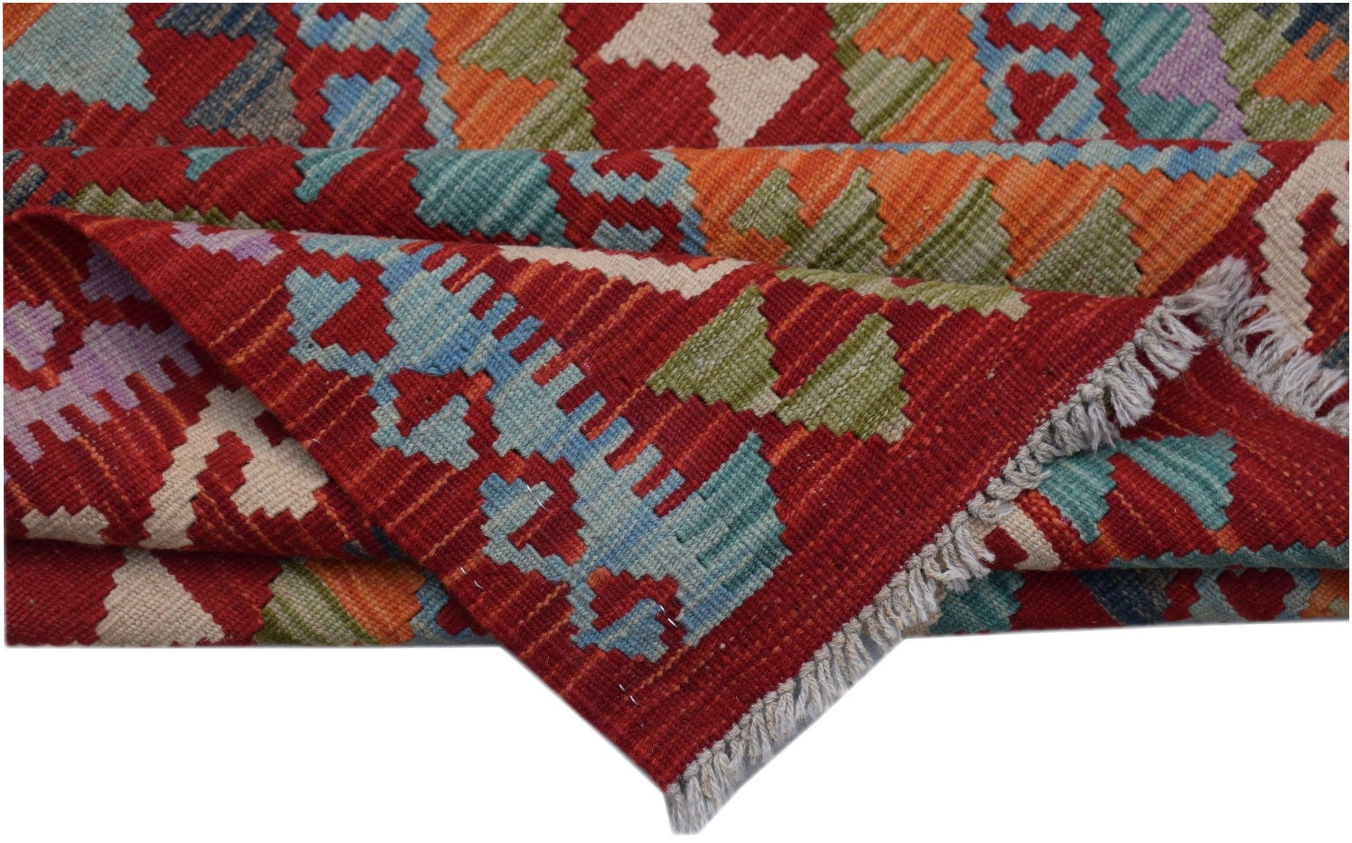 A handwoven Afghan Maimana kilim rug featuring a geometric pattern in red, orange, and blue.