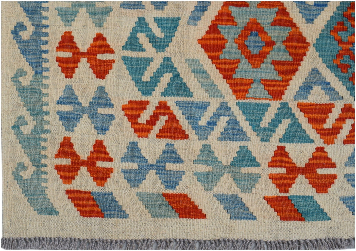 Handwoven Afghan Maimana kilim featuring a geometric pattern in shades of blue and orange.