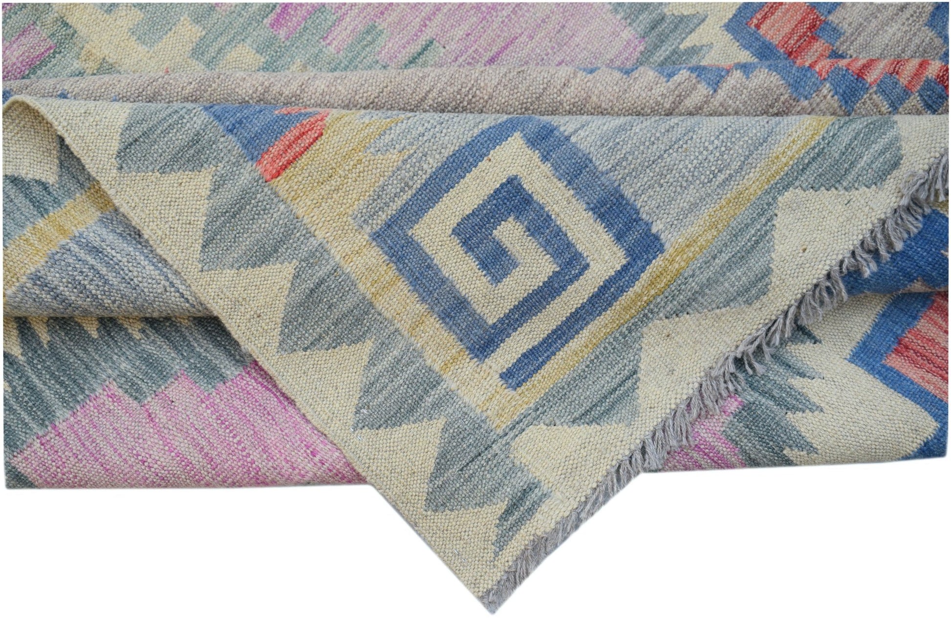 A handmade Afghan Maimana kilim rug featuring a geometric pattern in blue, pink, and cream wool.