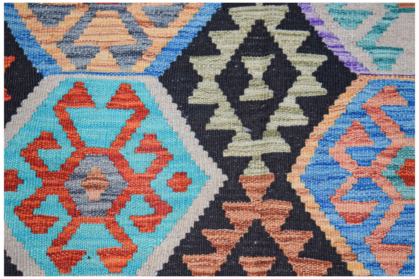 Afghan Maimana Kilim with geometric patterns in blue, orange, black, and beige.