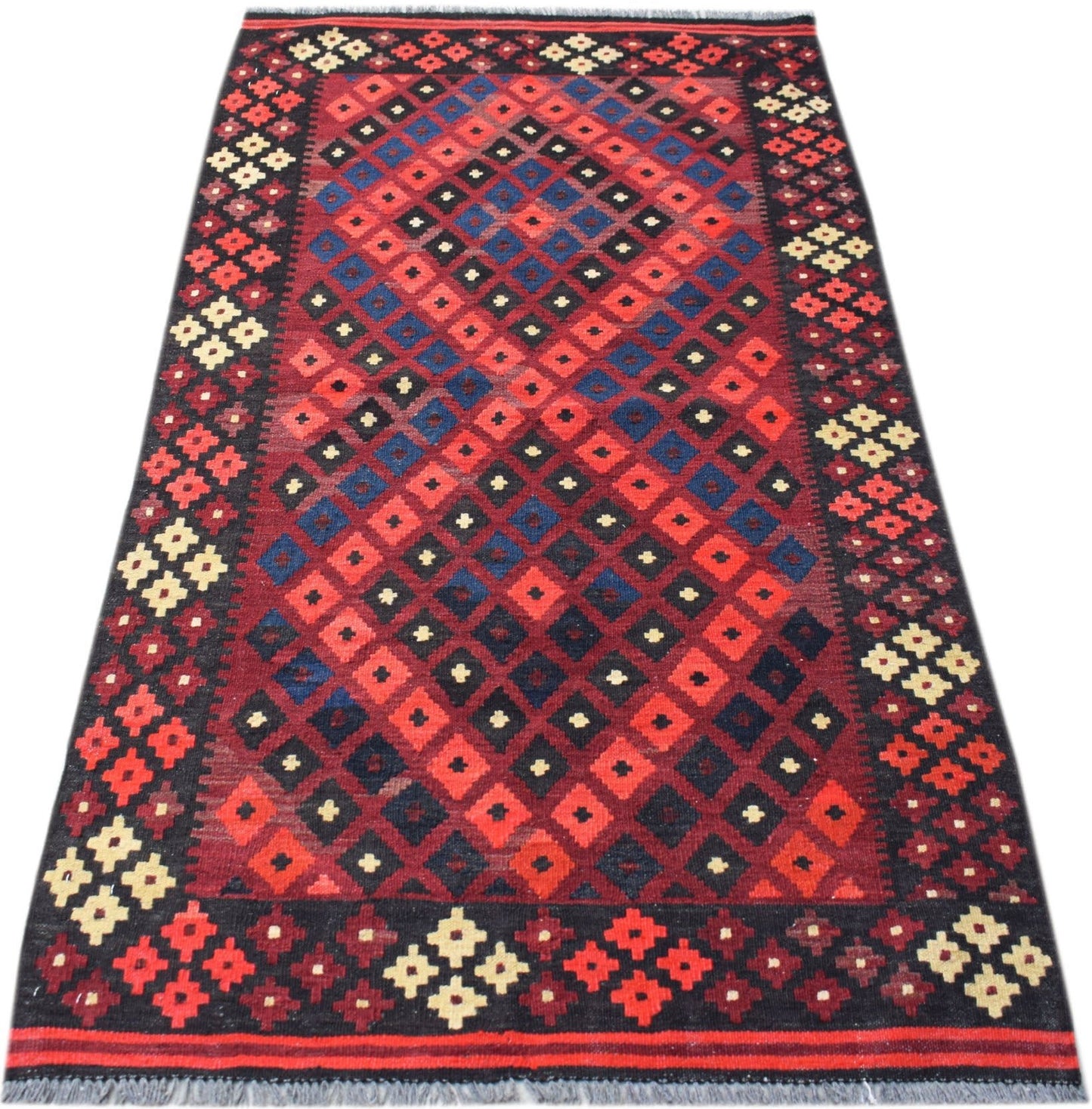 Handwoven Afghan Maimana kilim rug featuring a geometric diamond pattern in red, blue, and black.