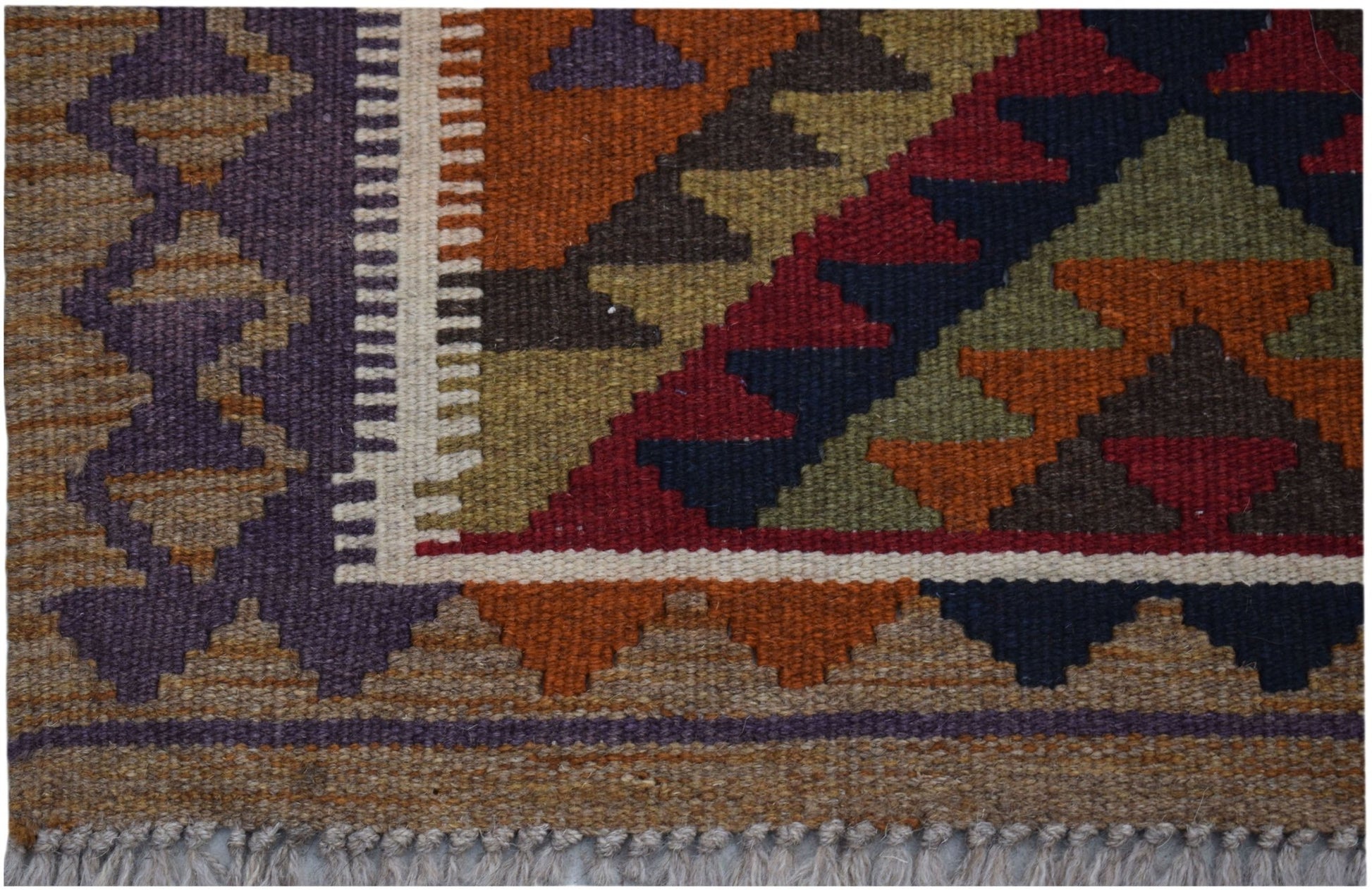 Handwoven Afghan Maimana kilim rug featuring a geometric pattern in rich, earthy tones.