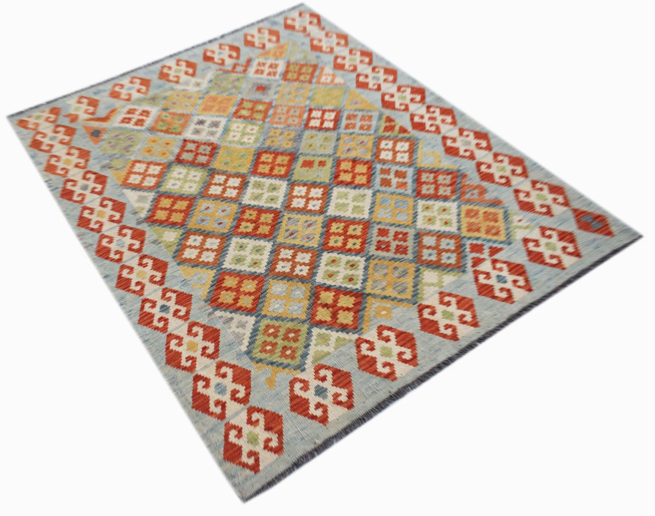 A handmade Afghan Maimana kilim rug featuring a geometric diamond pattern in vibrant colors.