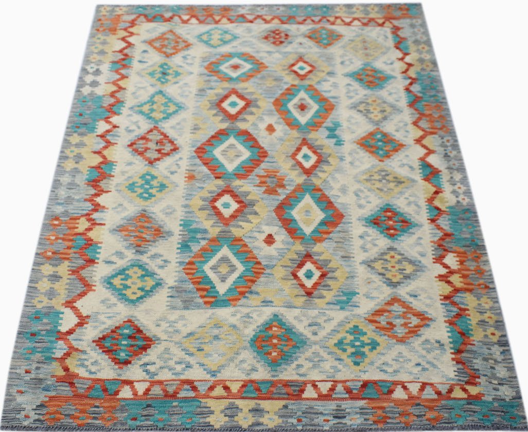 Handwoven Afghan Maimana kilim rug featuring a geometric diamond pattern in vibrant colors.