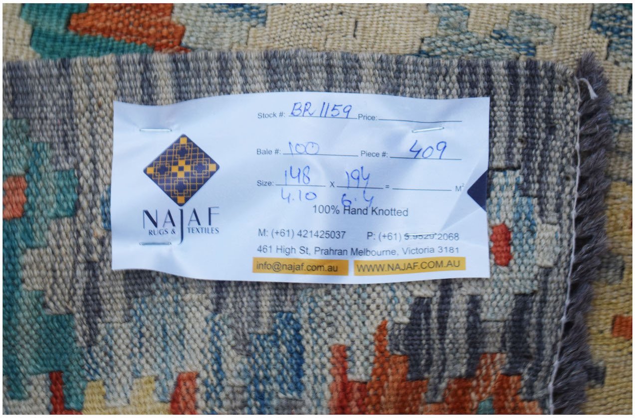 A handmade Afghan Maimana kilim featuring a colorful geometric pattern and flatweave texture.