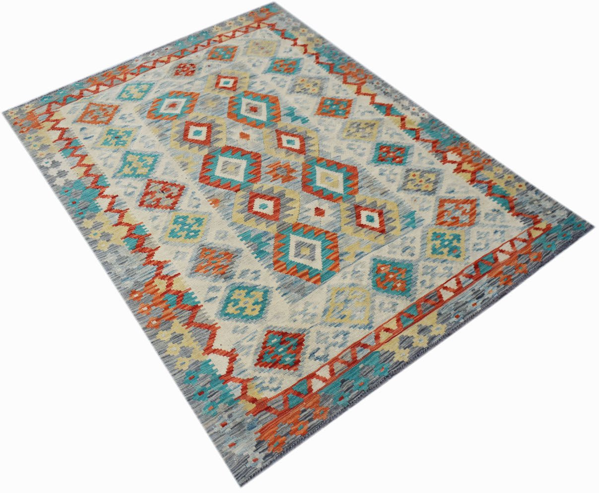 Handwoven Afghan Maimana kilim rug featuring a geometric pattern in orange, blue, and yellow.