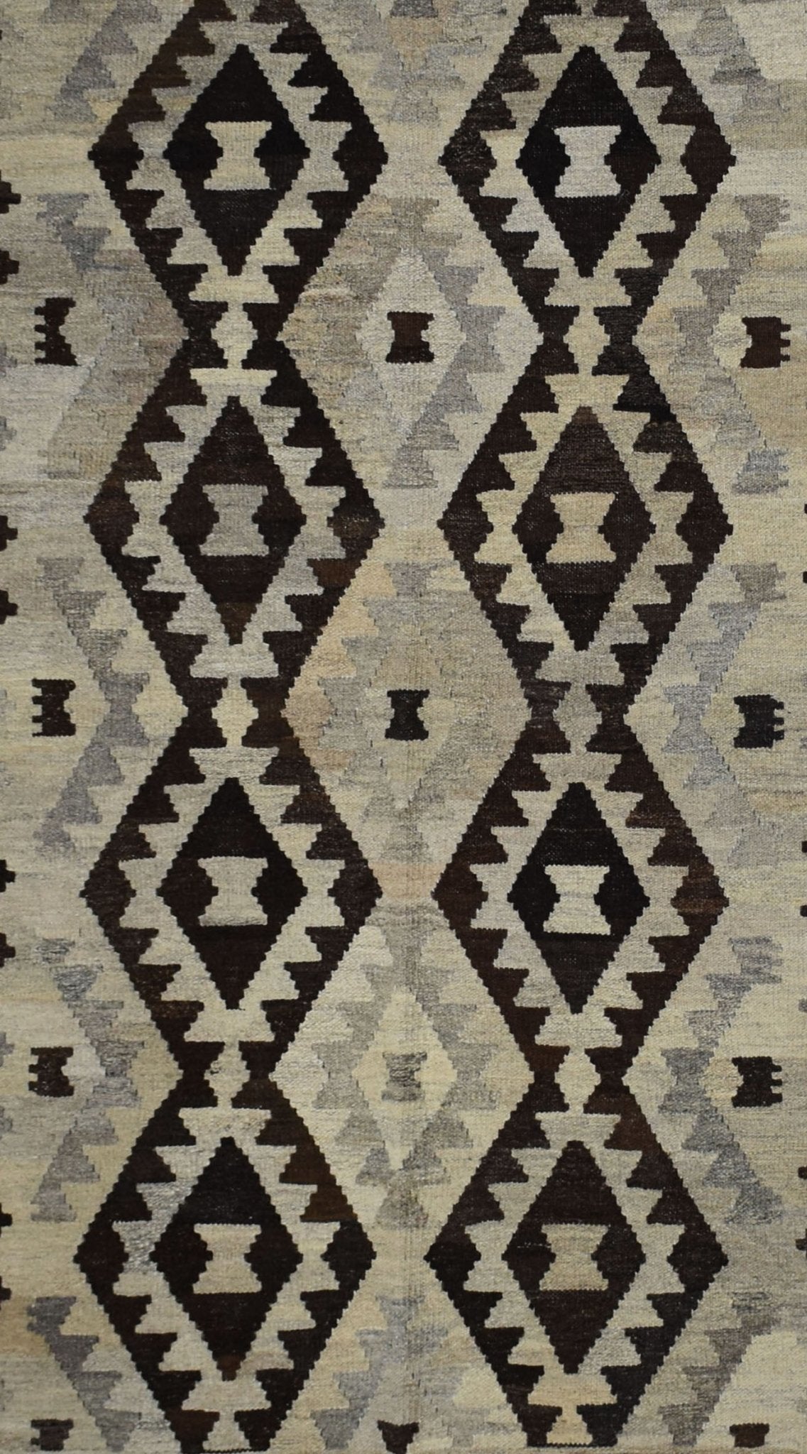 Handmade Afghan Maimana kilim rug featuring a repeating geometric diamond pattern in neutral tones.