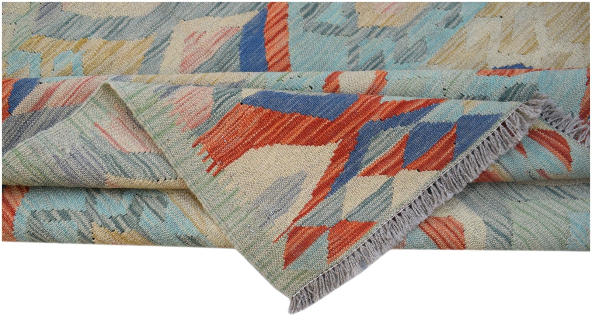 A handwoven Afghan Maimana kilim rug featuring geometric patterns in blue, orange, and cream wool.