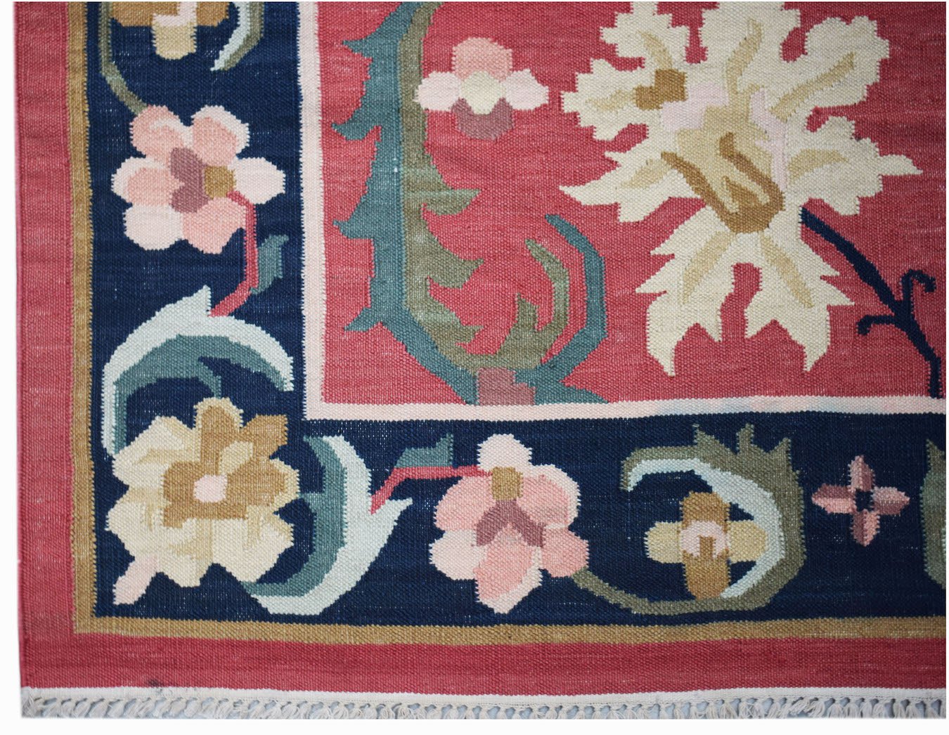 Handwoven Afghan Maimana kilim featuring a floral pattern in red, blue, and cream wool.