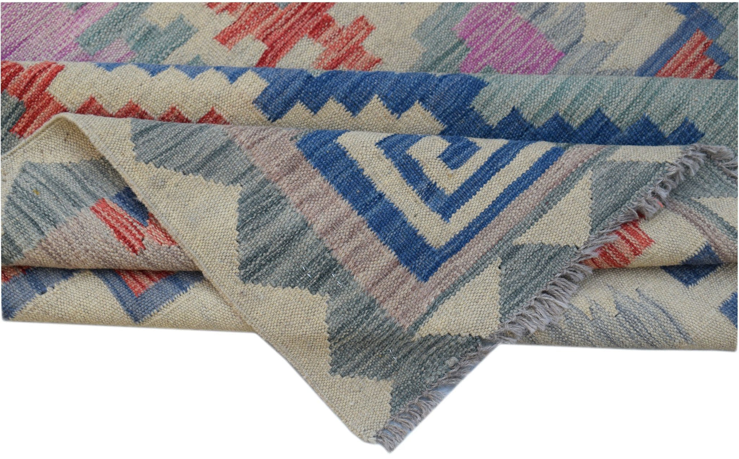 Handwoven Afghan Maimana kilim rug featuring a geometric pattern in blue, red, and neutral tones.