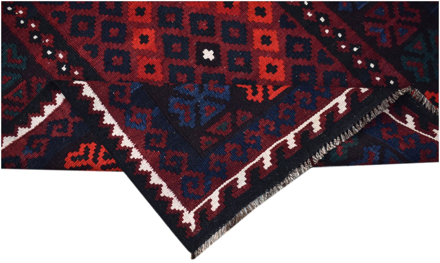 Handwoven Afghan Maimana kilim featuring a geometric pattern in red, blue, and black wool.