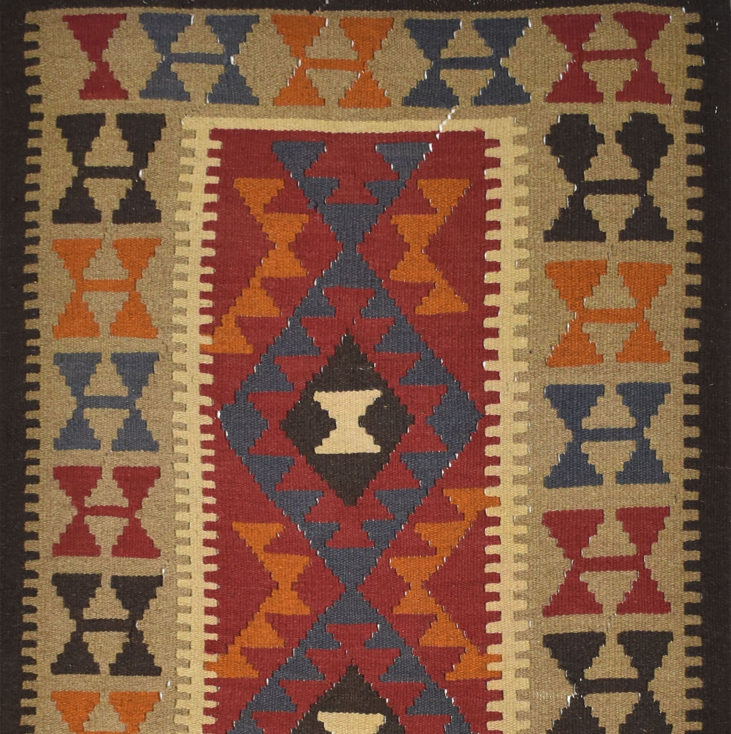 Handmade Afghan Maimana kilim rug featuring a geometric diamond pattern in red, orange, and blue.