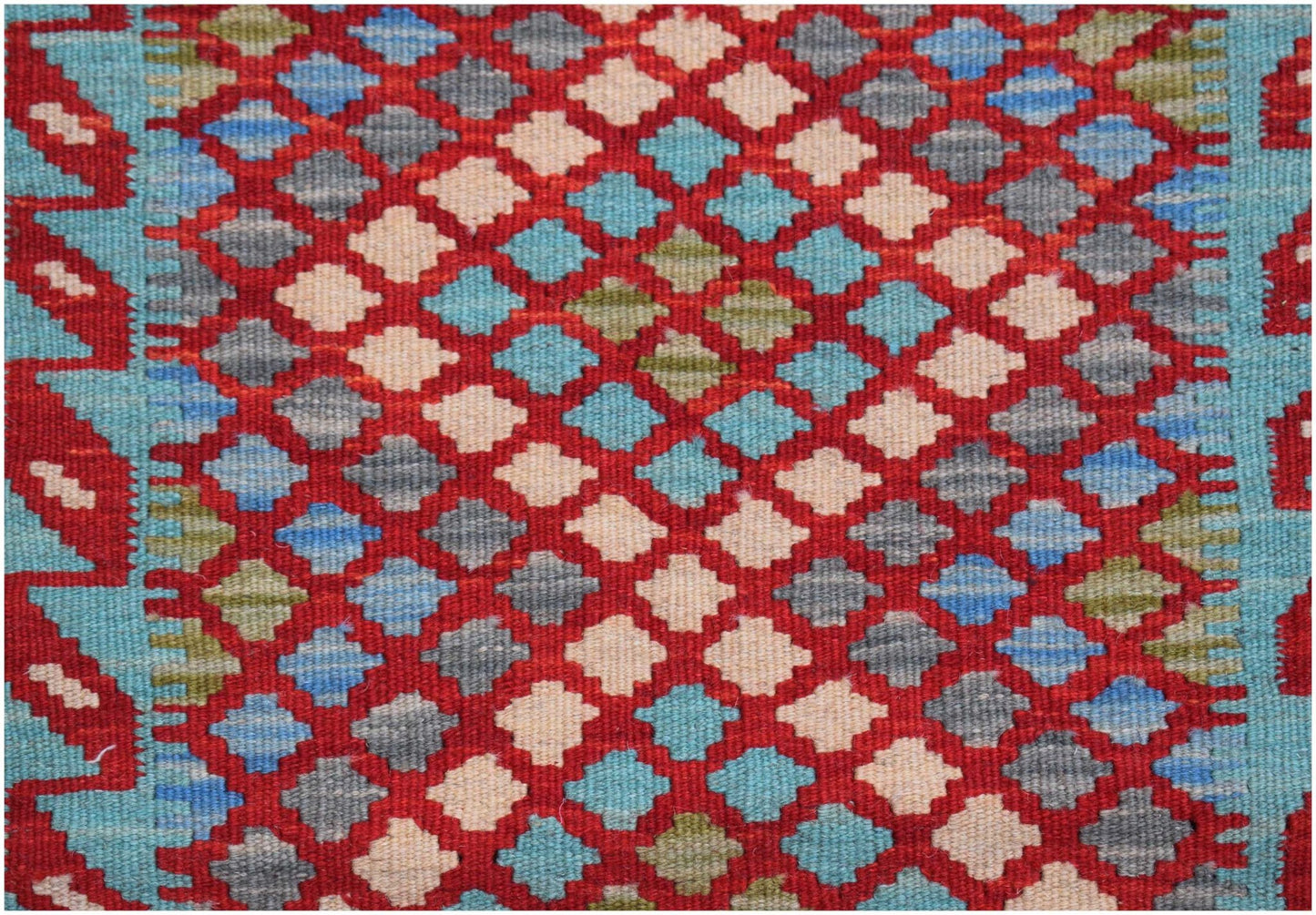 Handwoven Afghan Maimana kilim featuring a repeating geometric diamond pattern in red and blue.