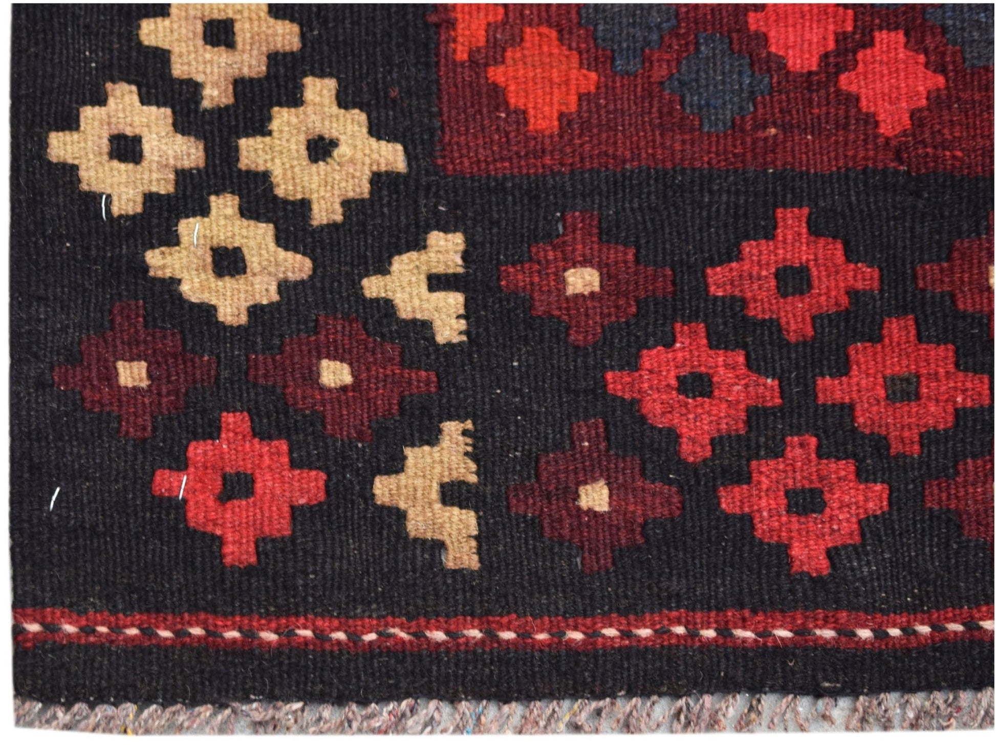 Handwoven Afghan Maimana kilim featuring geometric patterns in red, black, and beige wool.