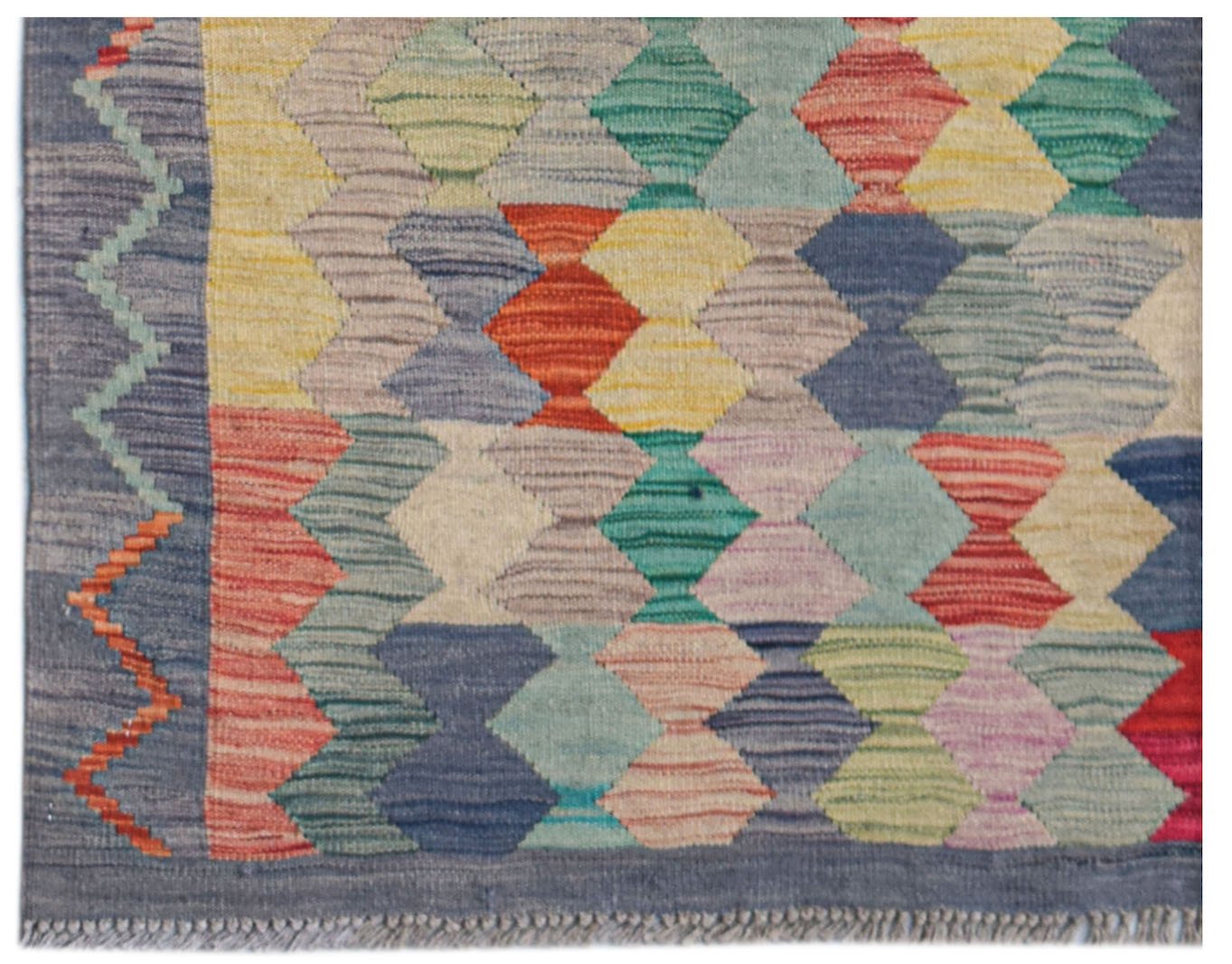Handwoven Afghan Maimana kilim rug featuring a colorful geometric diamond pattern.