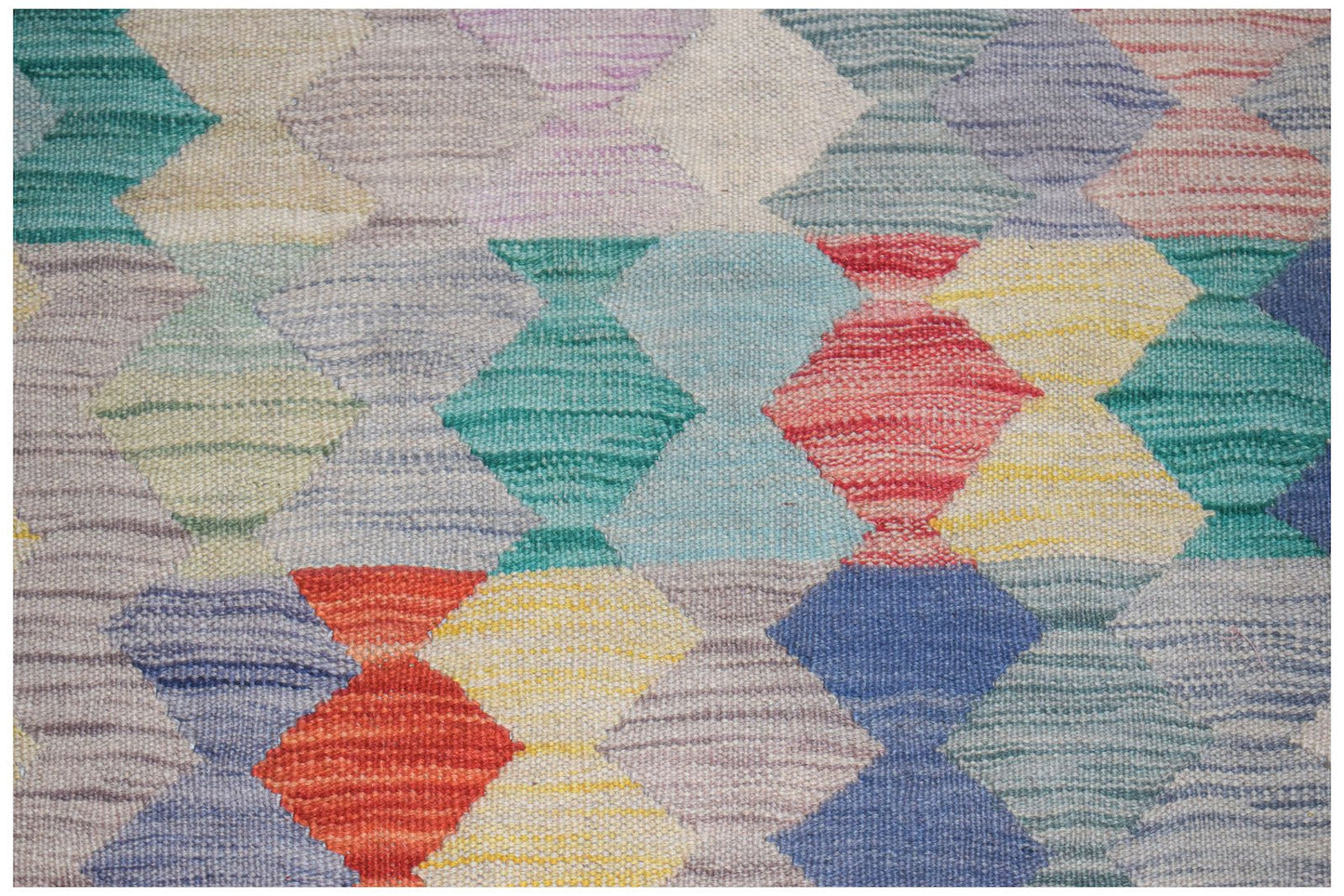 Afghan Maimana Kilim with a geometric diamond pattern in various colors.
