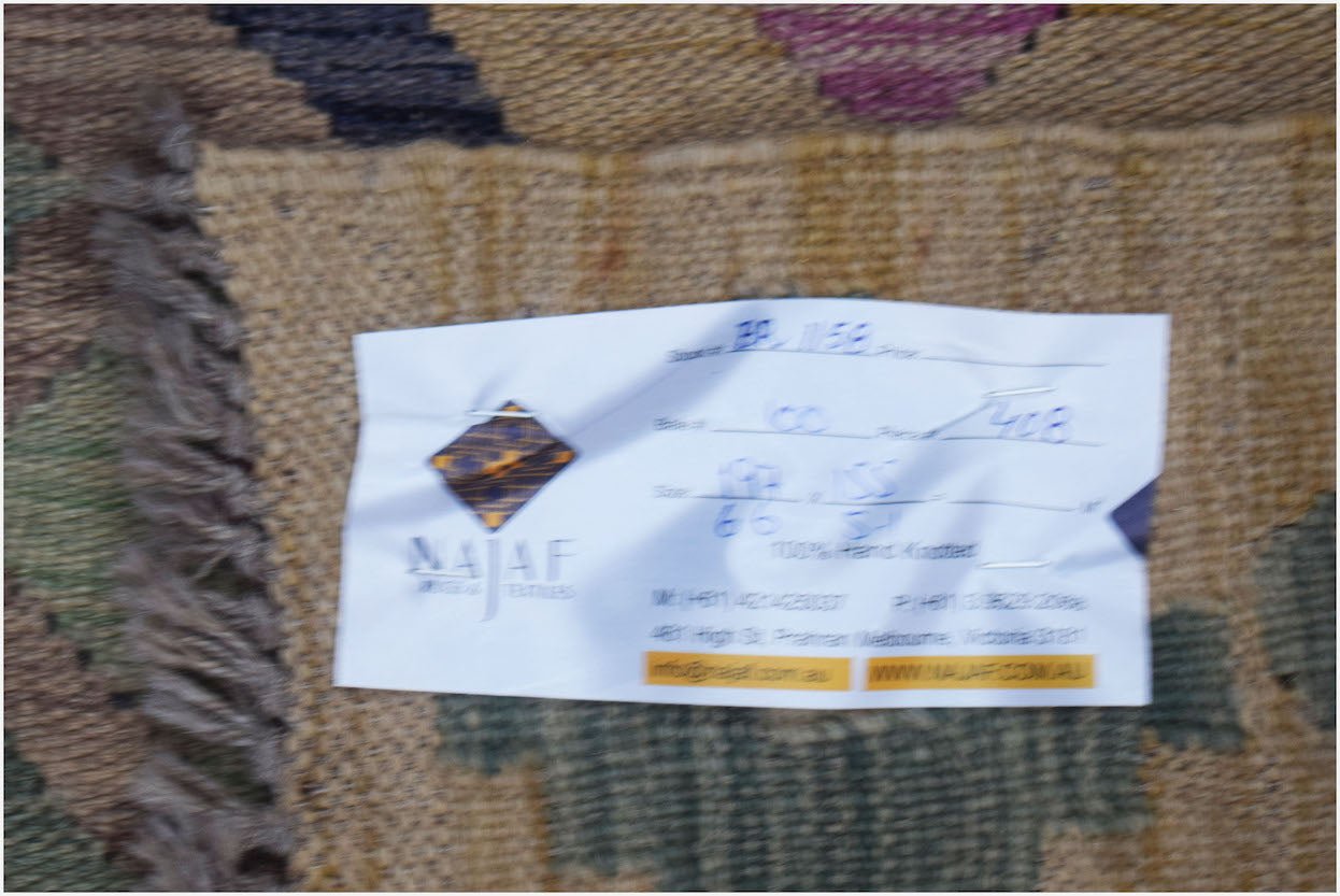 A handmade Afghan Maimana Kilim featuring a flatweave texture and geometric patterns.