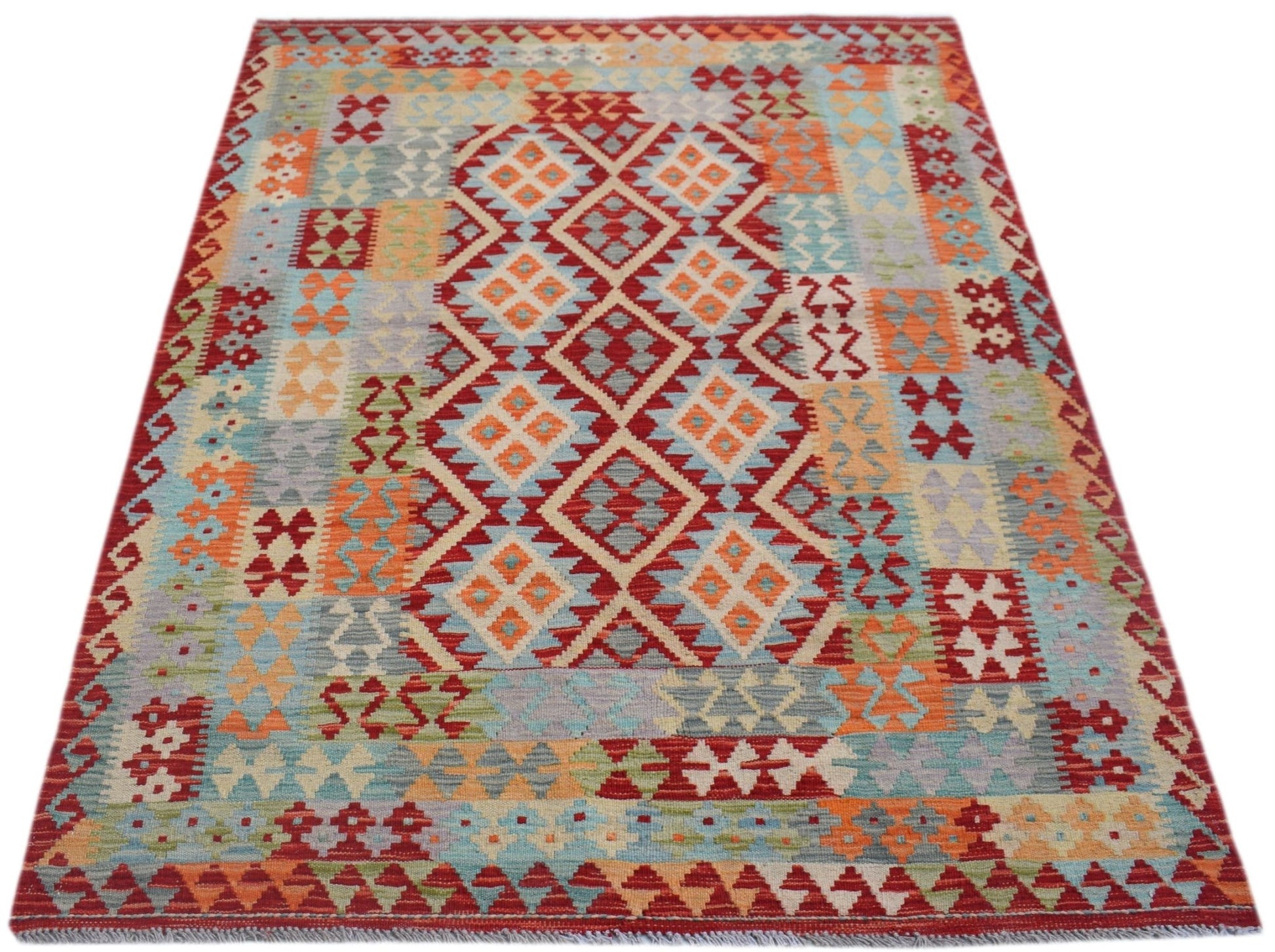 Handwoven Afghan Maimana kilim rug featuring a colorful geometric diamond pattern.