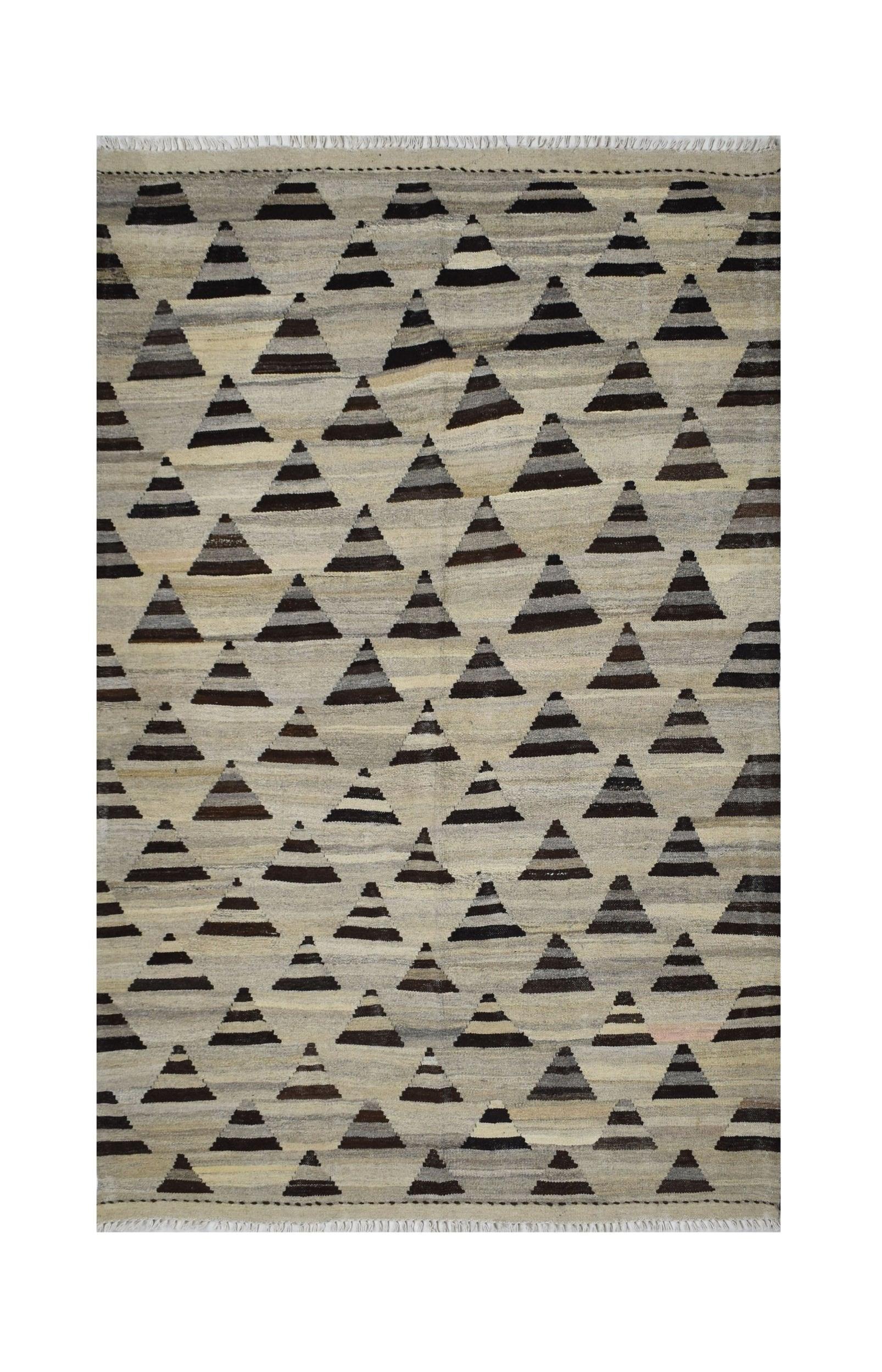 Handmade Afghan Maimana kilim rug featuring a repeating pattern of dark striped triangles.