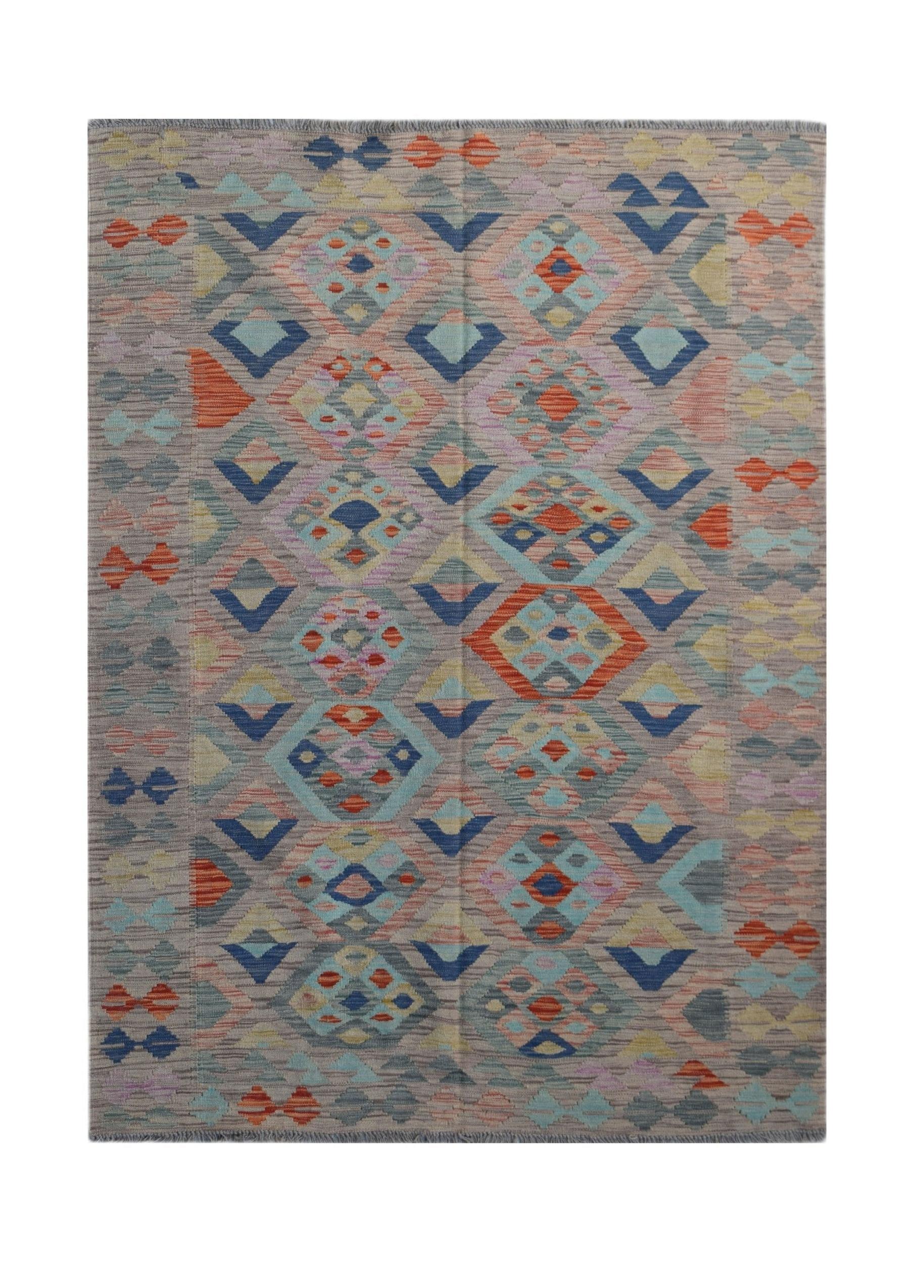 Handwoven Afghan Maimana kilim rug featuring a geometric diamond pattern in multicolored wool.
