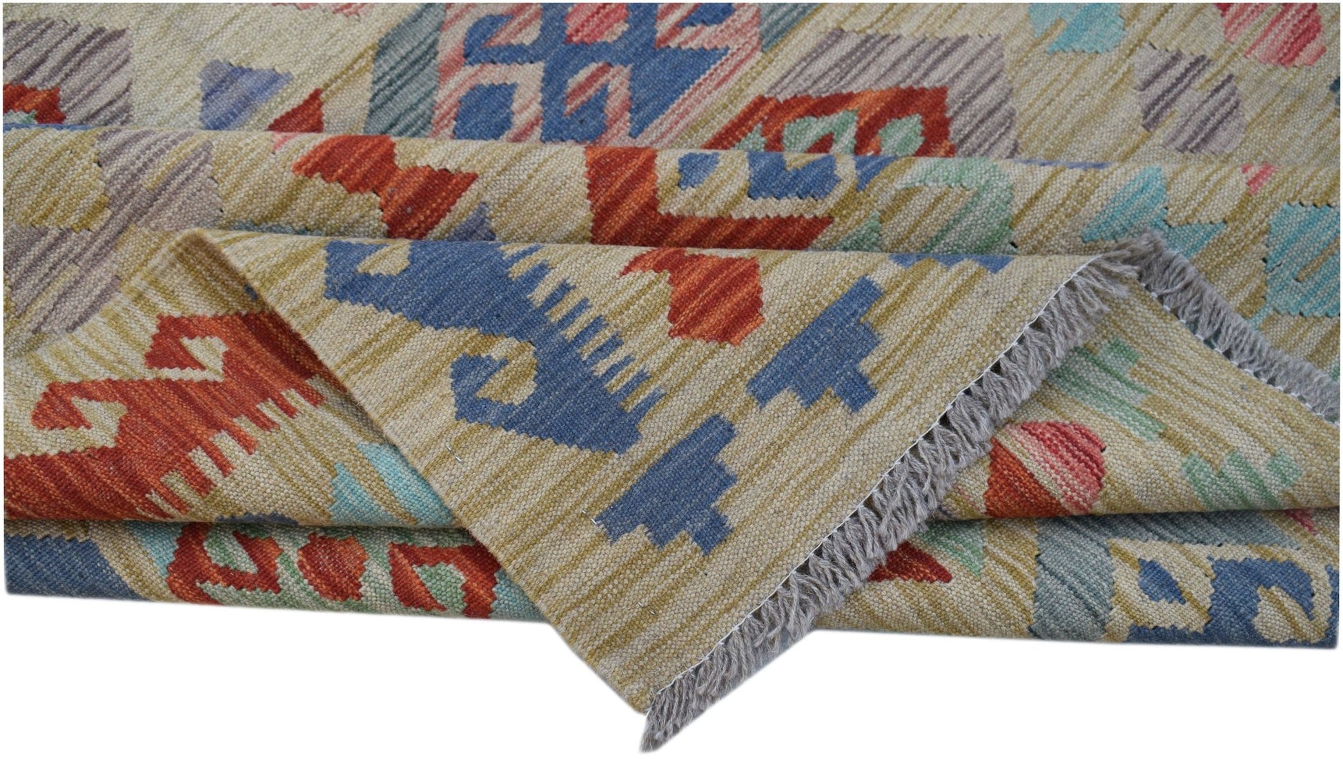 A handwoven Afghan Maimana kilim rug featuring geometric patterns in blue, red, and tan wool.