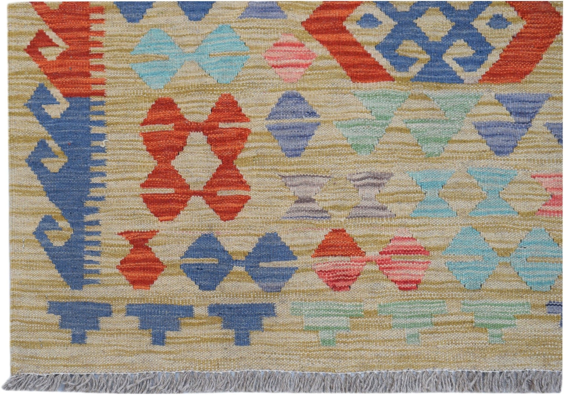 Handwoven Afghan Maimana kilim featuring a geometric pattern in vibrant multicolored wool.